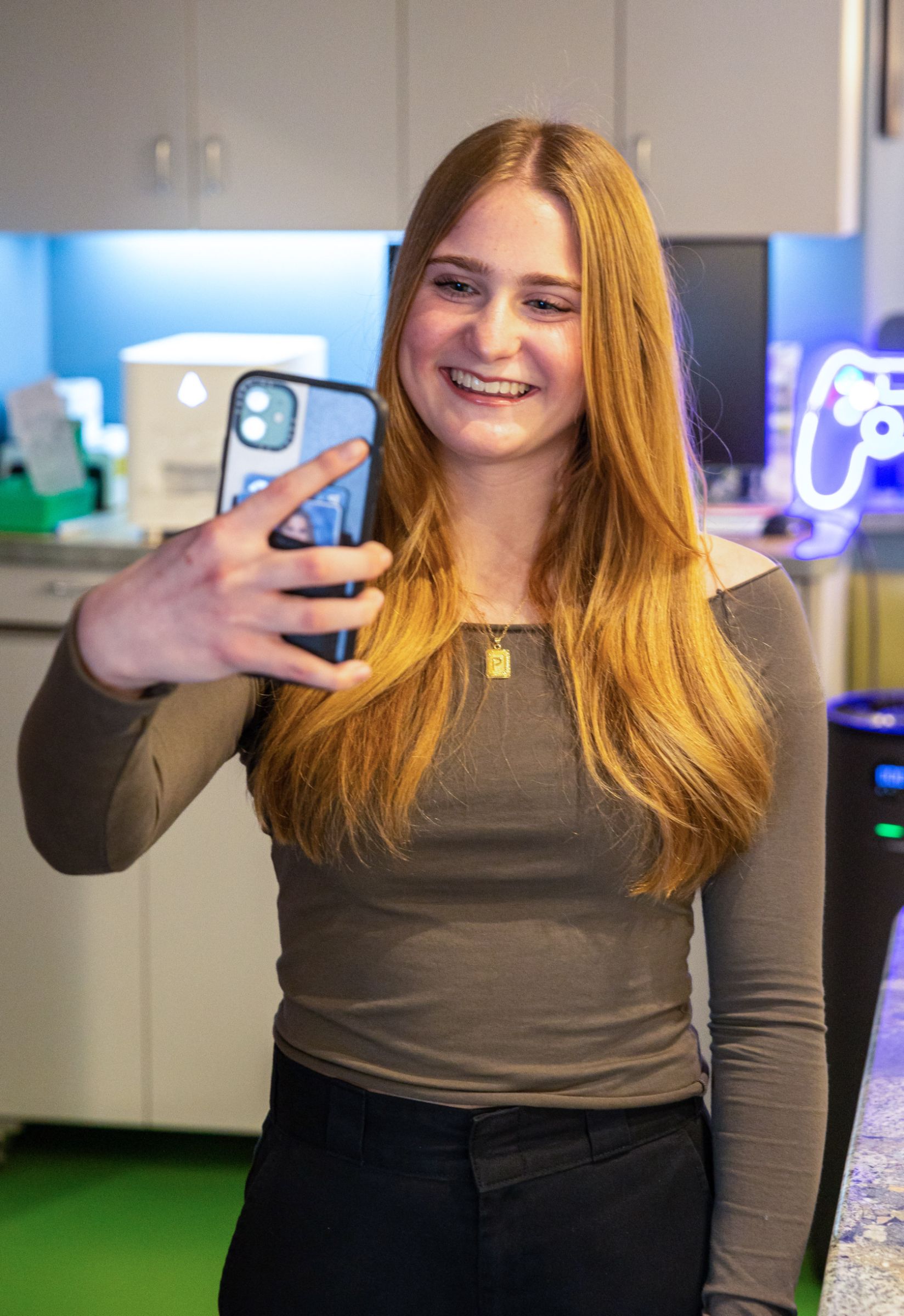 teen patient smiling and taking a selfie photo
