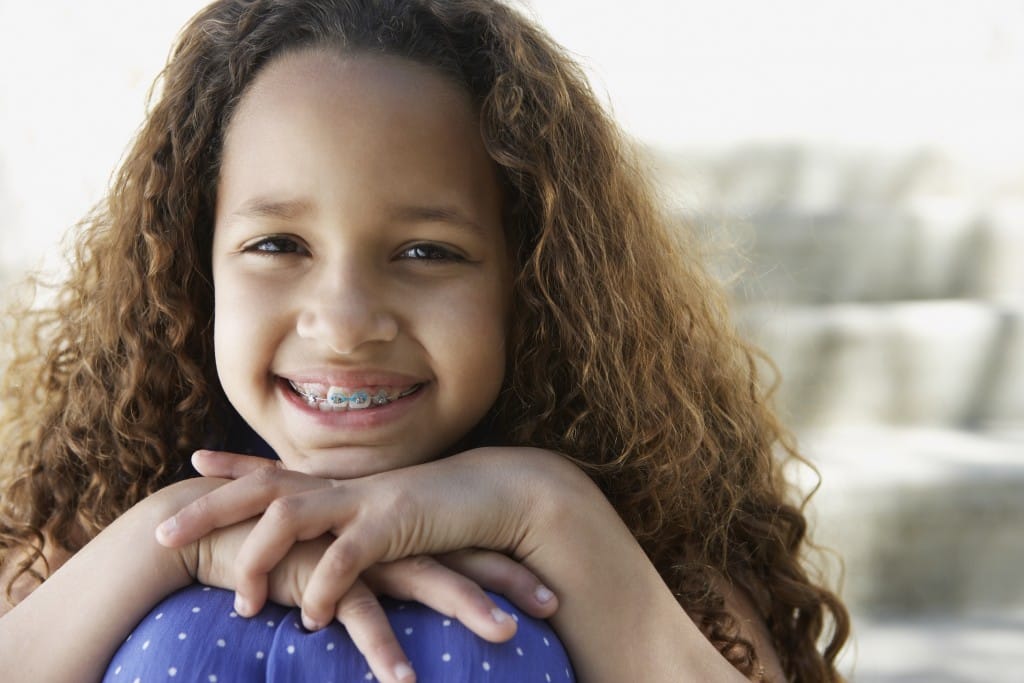 young girl with braces