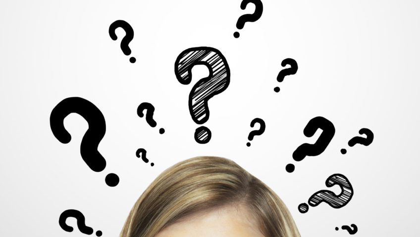 women with question marks about head