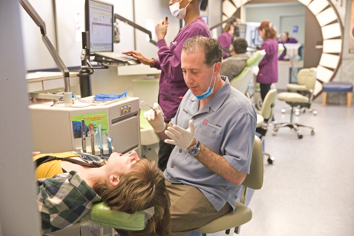 Dr. Brodsky working on a patient